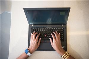 Woman hands on laptop